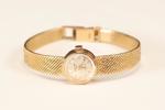Damur med armband,18k guld, Gigandet, diam ca 15 mm, totallängd 18 cm, totalvikt 28,4 gram